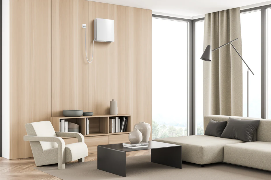 Ett hål borras i betongvägg för att kunna installera Mini-FTX i villa